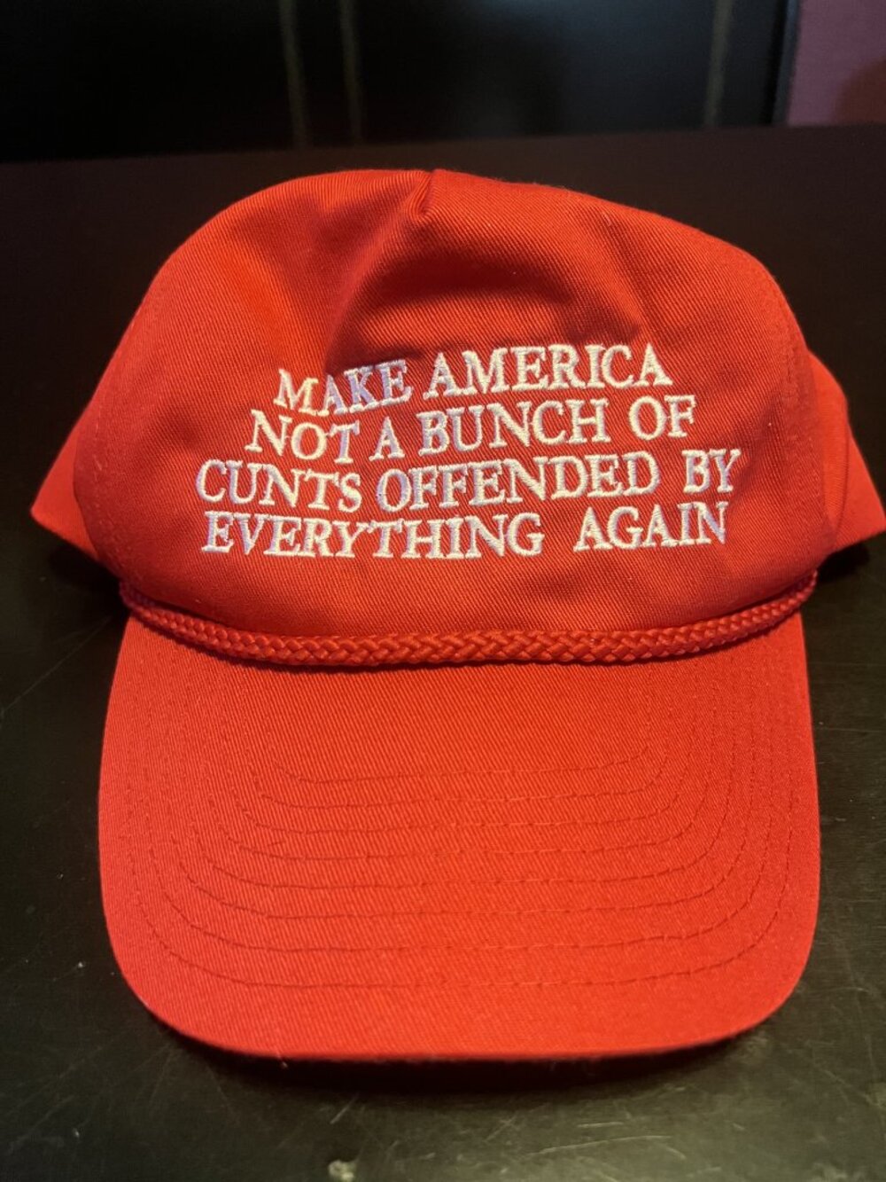 Assholes Live Forever red trucker hat